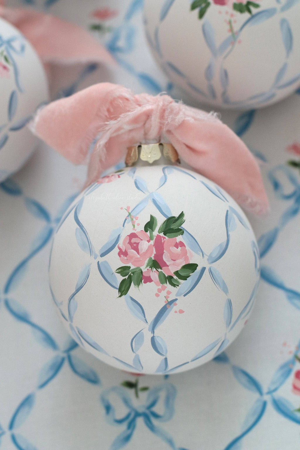 Ribbon trellis and rose hand-painted ornament