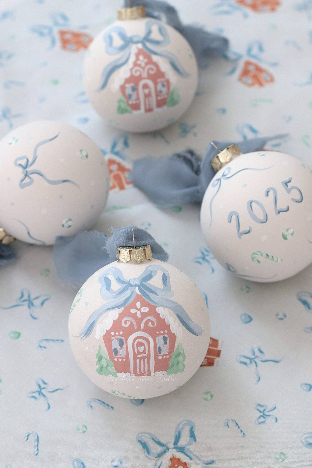 Blue gingerbread house hand-painted ornament: No year (bows and candy on reverse)