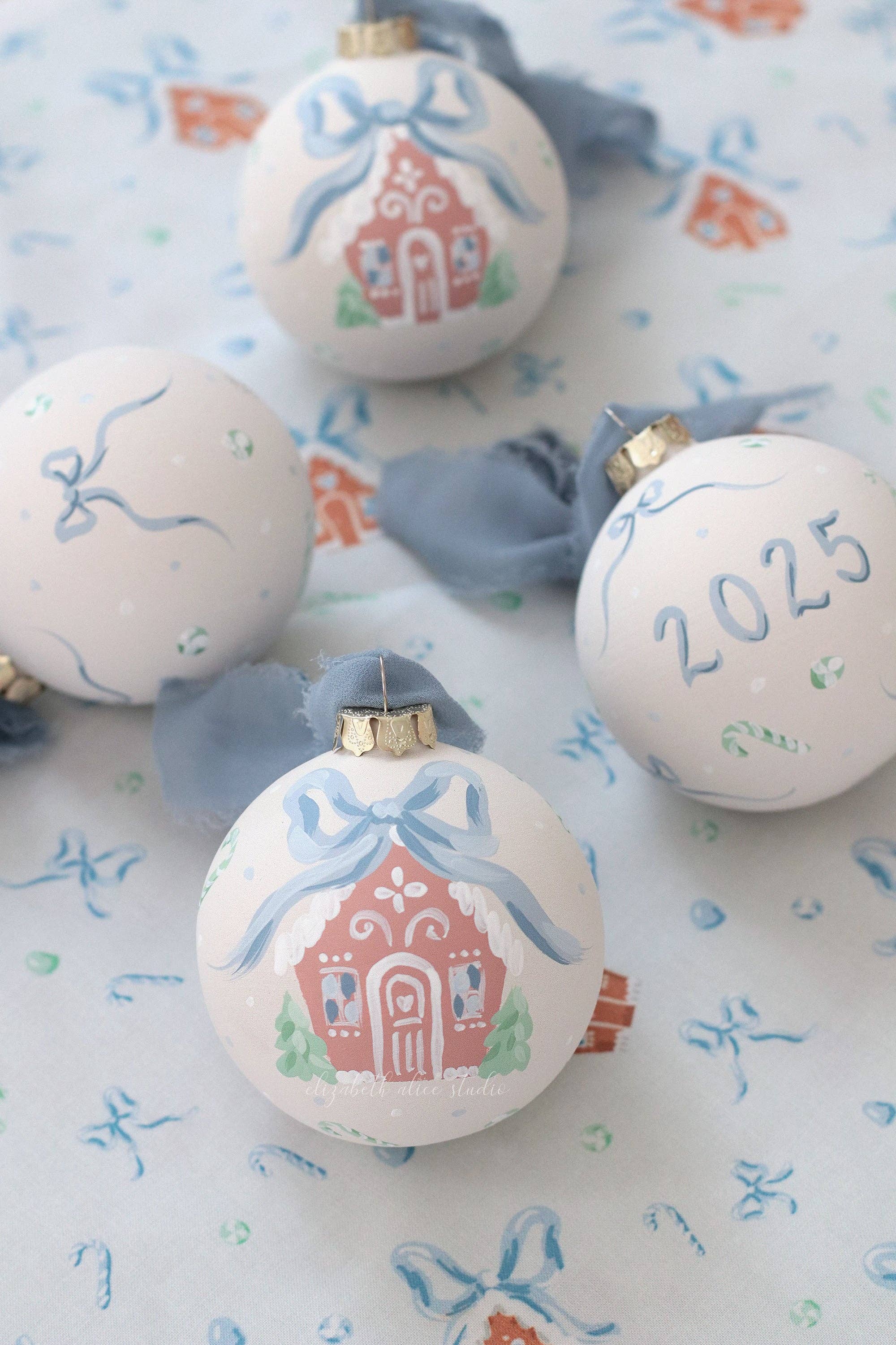 Blue gingerbread house hand-painted ornament: No year (bows and candy on reverse)