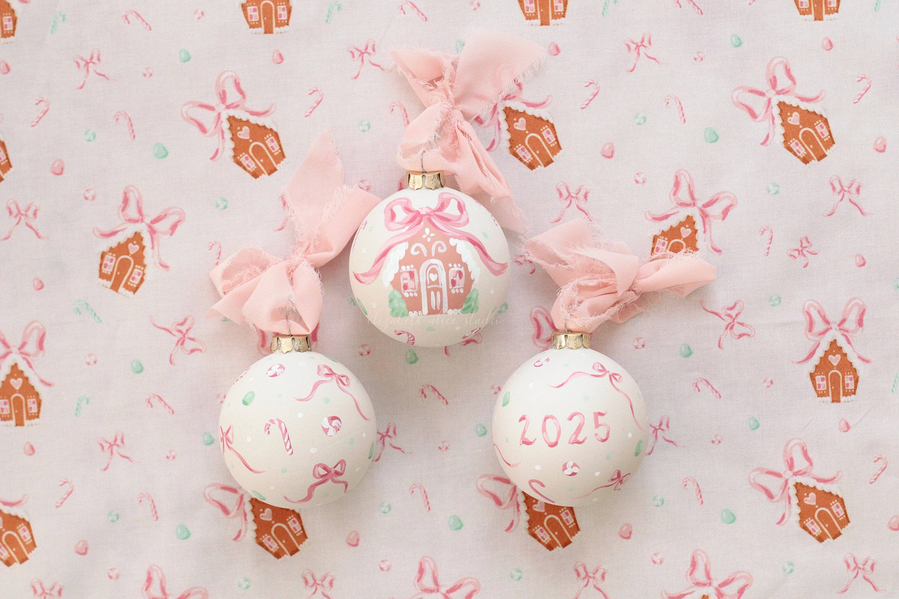Pink gingerbread house hand-painted ornament: No year (bows and candy on reverse)