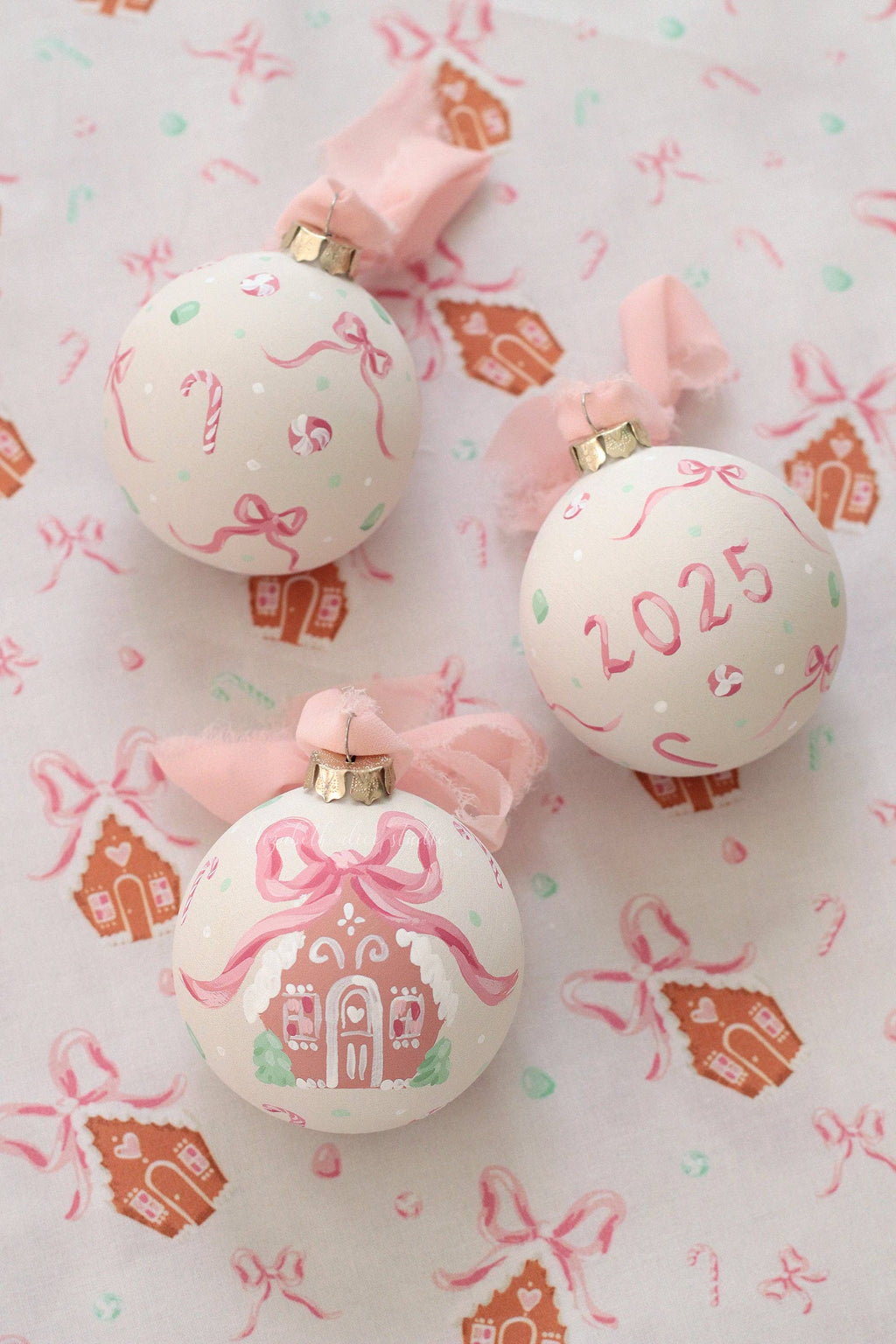 Pink gingerbread house hand-painted ornament: No year (bows and candy on reverse)