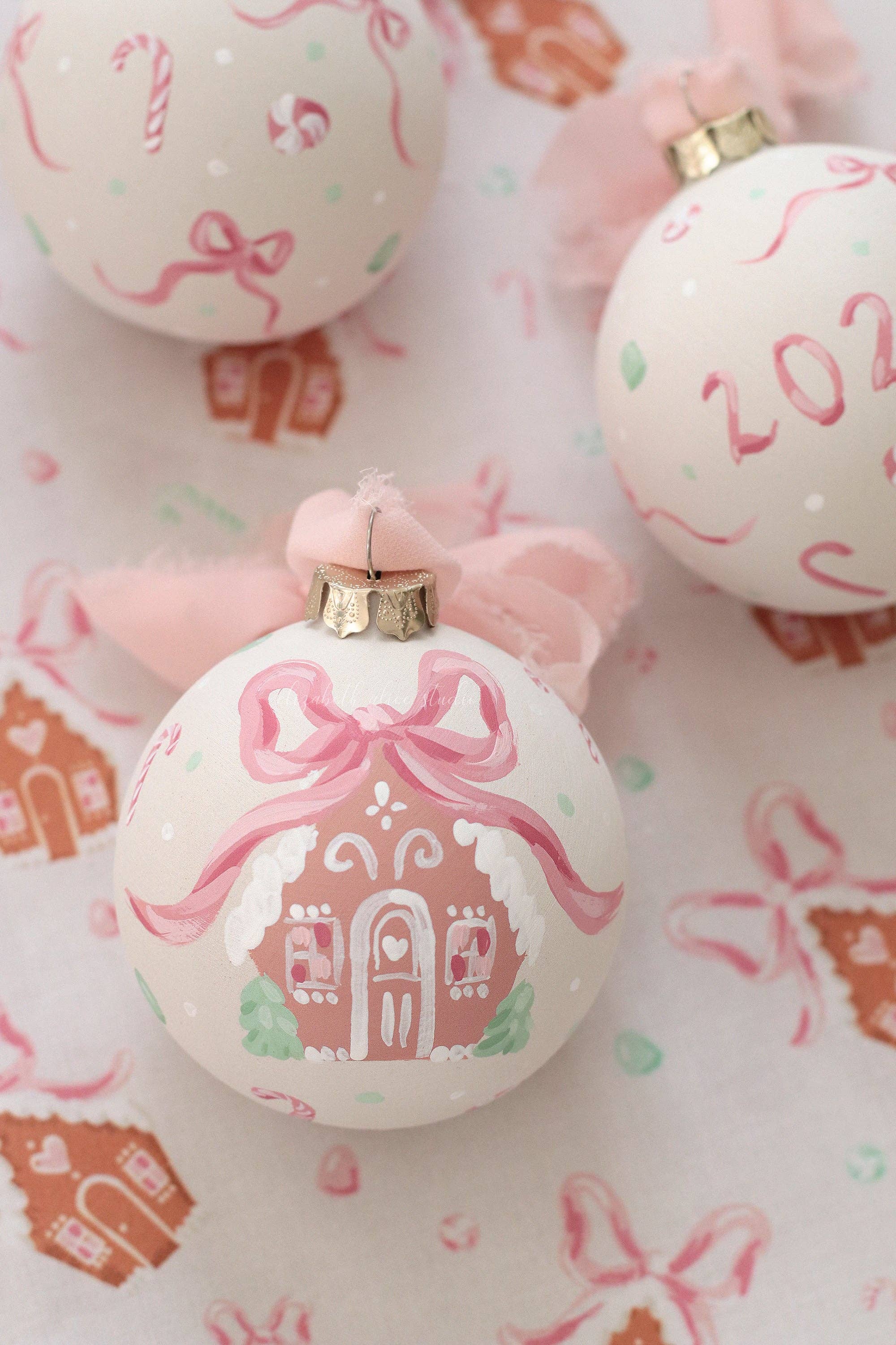 Pink gingerbread house hand-painted ornament: No year (bows and candy on reverse)