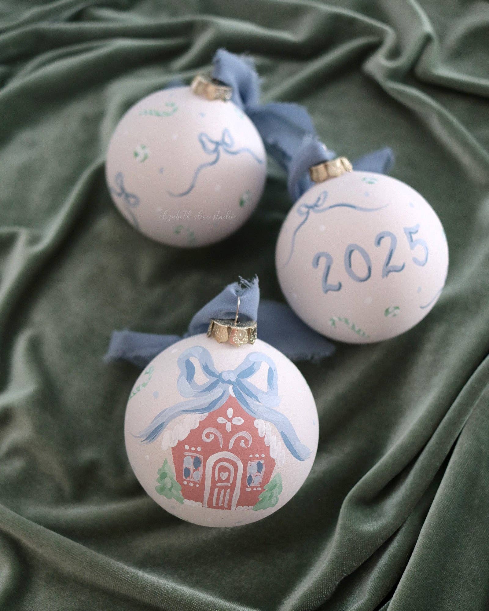 Blue gingerbread house hand-painted ornament: No year (bows and candy on reverse)