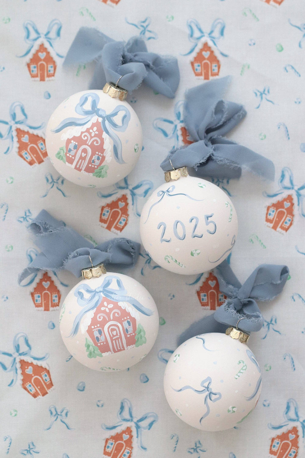 Blue gingerbread house hand-painted ornament: No year (bows and candy on reverse)